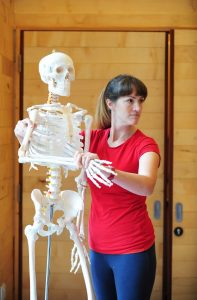 Photograph of teacher with skeleton model